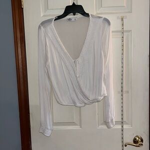Hollister-large- wrap up , long sleeve ivory top/shirt. Tie closure in front.